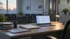 An empty health insurance enrollment assistance desk with a laptop and paper forms in a quiet office