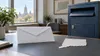 Conceptual image of a sealed ballot envelope beside a secure drop box and a Connecticut map cutout