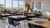 An empty, naturally lit Delaware public-school classroom prepared for a new academic program.