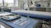 An unbranded neurology procedure room prepared for an intrathecal treatment in natural daylight