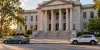 Generic Georgia courthouse with two unbranded cars parked along the street