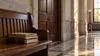 Quiet courthouse corridor with closed courtroom doors and legal folders in late-afternoon light