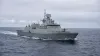 Unmarked modern naval frigate underway in the North Atlantic under overcast daylight