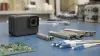 Unbranded action camera and optical transceiver modules on an electronics engineering workbench in natural light