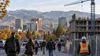 Illustration of workers commuting near a commercial construction site in Boise, Idaho.