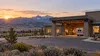 Rural Idaho healthcare clinic with an ambulance bay and mountains in the distance