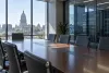 Empty government conference room overlooking a state capitol beside secure computer servers