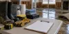 Blank recovery forms, boots, gloves and cleanup supplies inside a water-damaged home