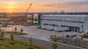 Generic Indiana manufacturing and logistics complex at sunrise