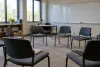 Empty teacher-training seminar room with chairs arranged in a circle