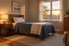An empty, orderly foster-family bedroom with a made bed and warm morning light in Kansas