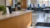 A quiet county election office prepared with privacy booths and blank forms.