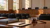 Empty public school board meeting room with a gavel and folders in warm daylight