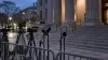 Television cameras and microphones outside a courthouse after a federal verdict