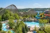 AI-generated illustrative view of a wooded amusement park with wooden roller coasters and colorful water slides.