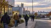 Workers leave a generic Michigan manufacturing and service-sector district at shift change.