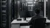 A technology professional monitoring blank screens in an unbranded data center
