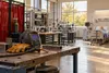 A generic community-college technical lab with welding, industrial controls and healthcare training equipment.