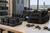 Body cameras, radios, safety vests and vehicle keys arranged in a municipal public-safety equipment room.
