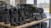 Ballistic vests, body cameras, radios and mobile data terminals arranged in a municipal equipment bay