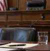Photorealistic editorial crop of a formal American government and legal setting.