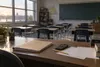 Empty Missouri classroom with a budget folder and calculator on the teacher’s desk