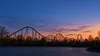 Illustrative twilight view of a generic Missouri amusement park roller coaster.
