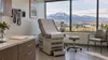 Empty clinical consultation room with a mountain view and a blank patient folder