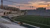 Conceptual view of a college football stadium undergoing a partial renovation at twilight