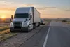 Conceptual view of a semi truck stopped along an Interstate highway across the Nebraska plains.
