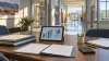 Blank assessment folders and abstract charts on a conference table in an empty Nevada school