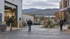 Workers approach a small New Hampshire commercial district on an overcast early autumn morning.