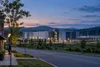 Conceptual view of an unbranded data center beside a quiet road and utility infrastructure in upstate New York.