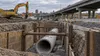 Stormwater infrastructure construction beside an urban highway in Syracuse