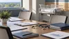 Empty hospital quality-improvement meeting room with an infant bassinet, charts and stethoscope