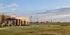A public school campus on the North Dakota prairie near a distant military airfield
