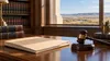 Illustrative courthouse law-library desk with a closed medical file and judge's gavel against a prairie landscape.