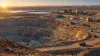 A large open-pit gold mine and processing complex in Western Australia at sunrise.