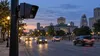 Roadside license plate reader camera overlooking evening traffic on a Midwestern city avenue
