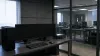 Unbranded cybersecurity research workstation in an isolated testing lab with blank monitors and network hardware