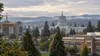 Oregon Capitol, housing construction and a school campus under overcast morning skies