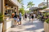Illustration of visitors at an unbranded outdoor dining promenade in Central Florida