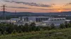 Generic modern data center and power infrastructure in the Pennsylvania landscape at dusk