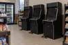 Unbranded skill-game machines powered off inside a Pennsylvania convenience store