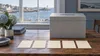 A neutral election workspace with five blank ballot papers arranged beside an unmarked ballot box
