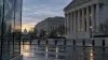 Washington federal courthouse district at dawn with a subtle world map reflected in glass.