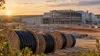 A large cable manufacturing facility under construction along a rural South Carolina industrial corridor