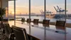 Empty port boardroom overlooking cargo cranes and container ships in South Carolina