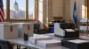 Illustrative South Dakota election office with sealed ballot boxes and an optical scanner