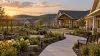 Illustrative modern veterans skilled nursing campus with accessible paths and a landscaped courtyard in West Tennessee